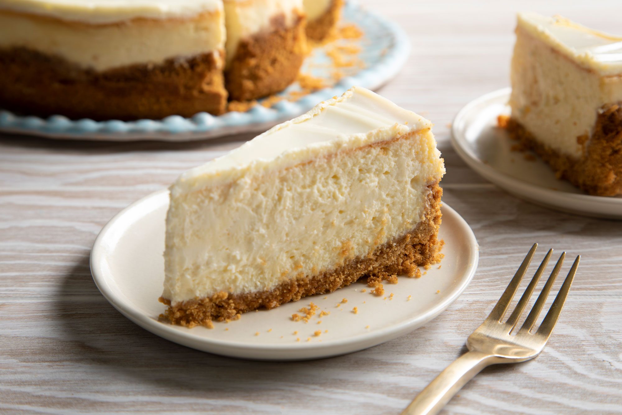 Copycat Cheesecake Factory Cheesecake slice served in a plate with fork