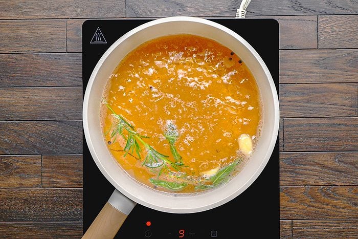 salt, brown sugar, peppercorns, sage, garlic, thyme, rosemary and 1 quart of water in a saucepan