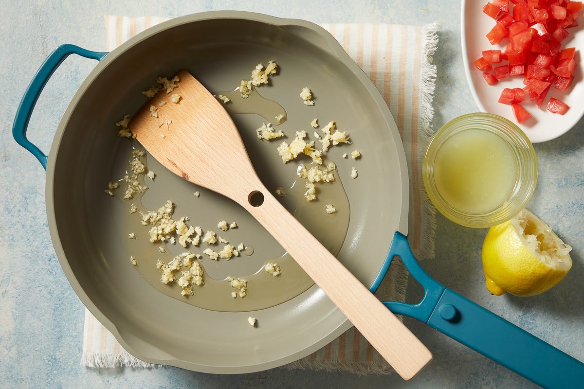 sautéing garlic in a skillet
