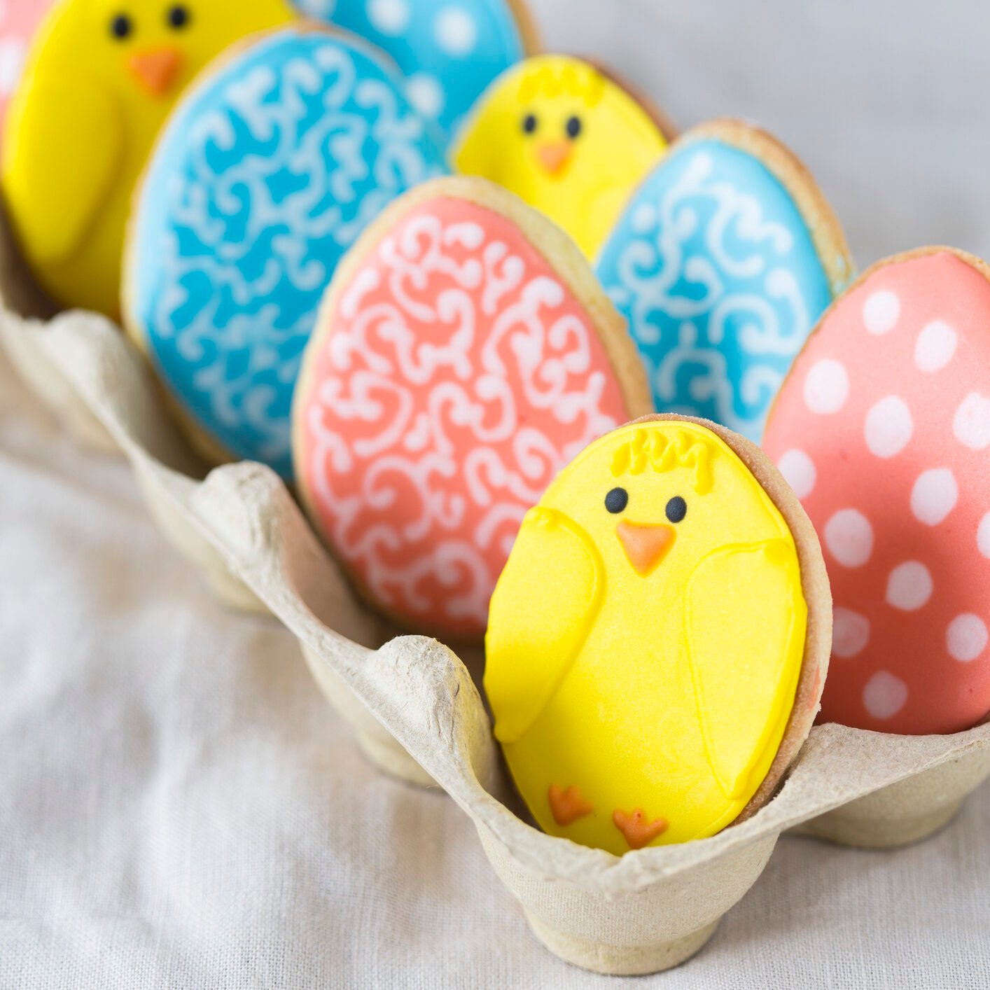 Colourful Easter biscuits in an egg box