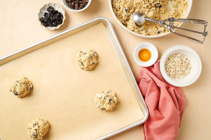 Dropped dough by scant 1/4 cupfuls, placed three inches apart onto non greased baking sheets