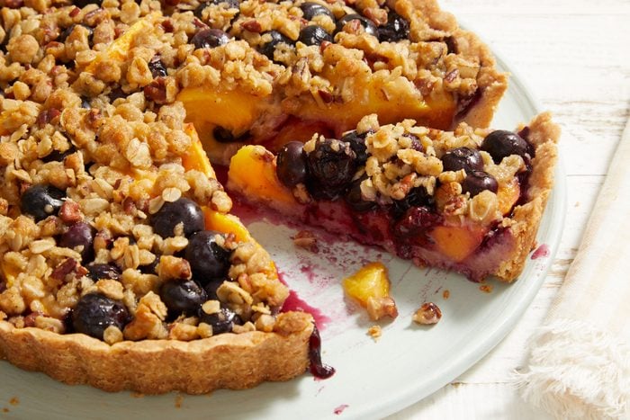 Close up shot of Peach-Blueberry Crumble Tart