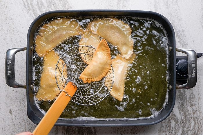 removing fried pies from oil