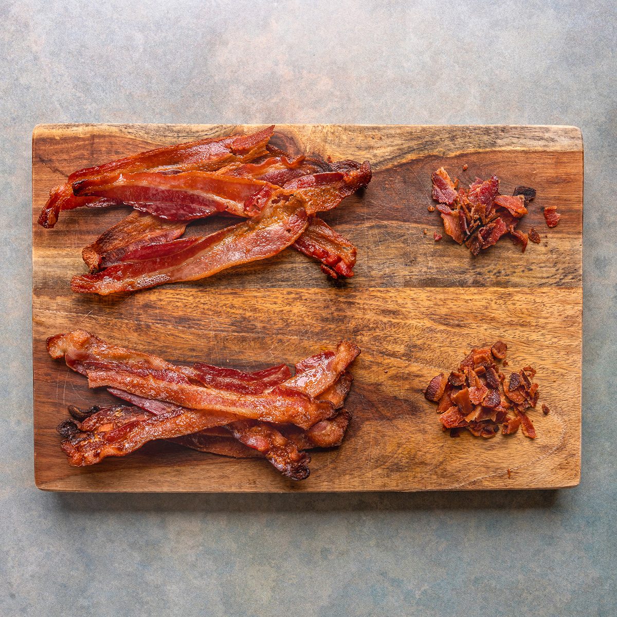 Costco's Coleman Bacon and Kirkland Bacon cooked placed on a wooden board