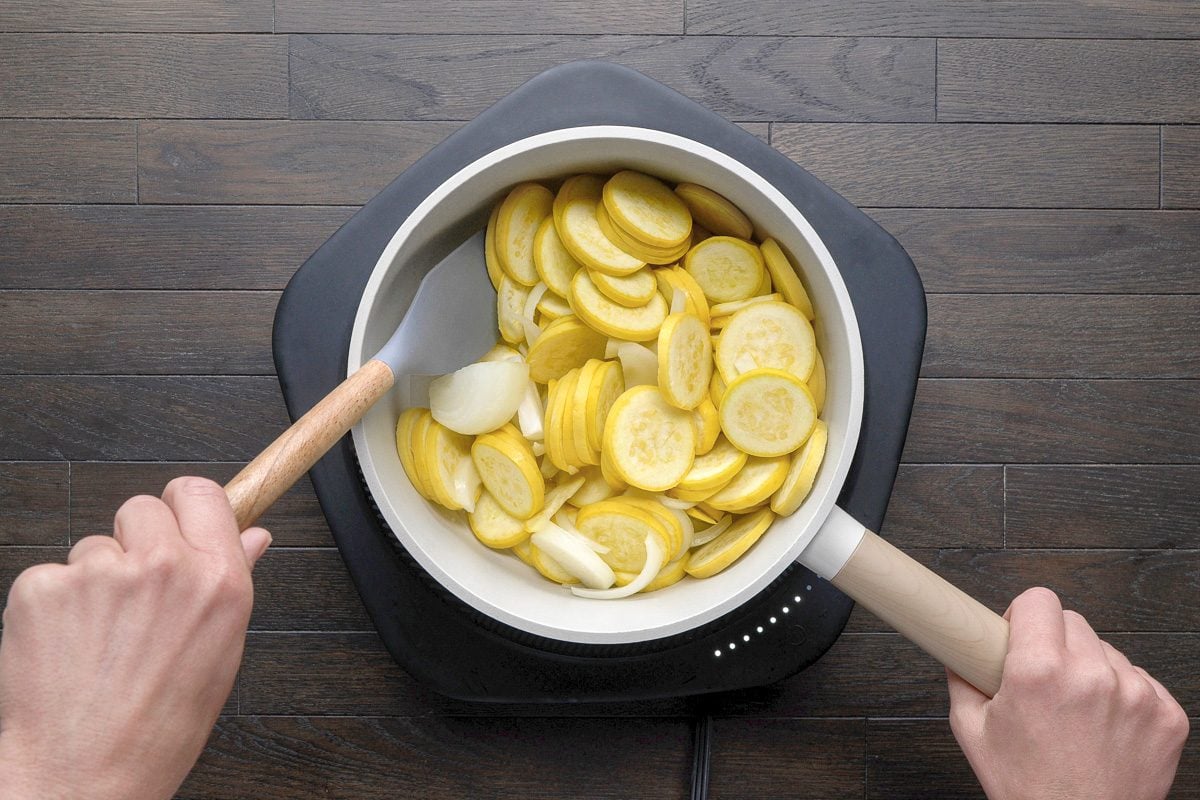 heating squash and onion in a saucepan