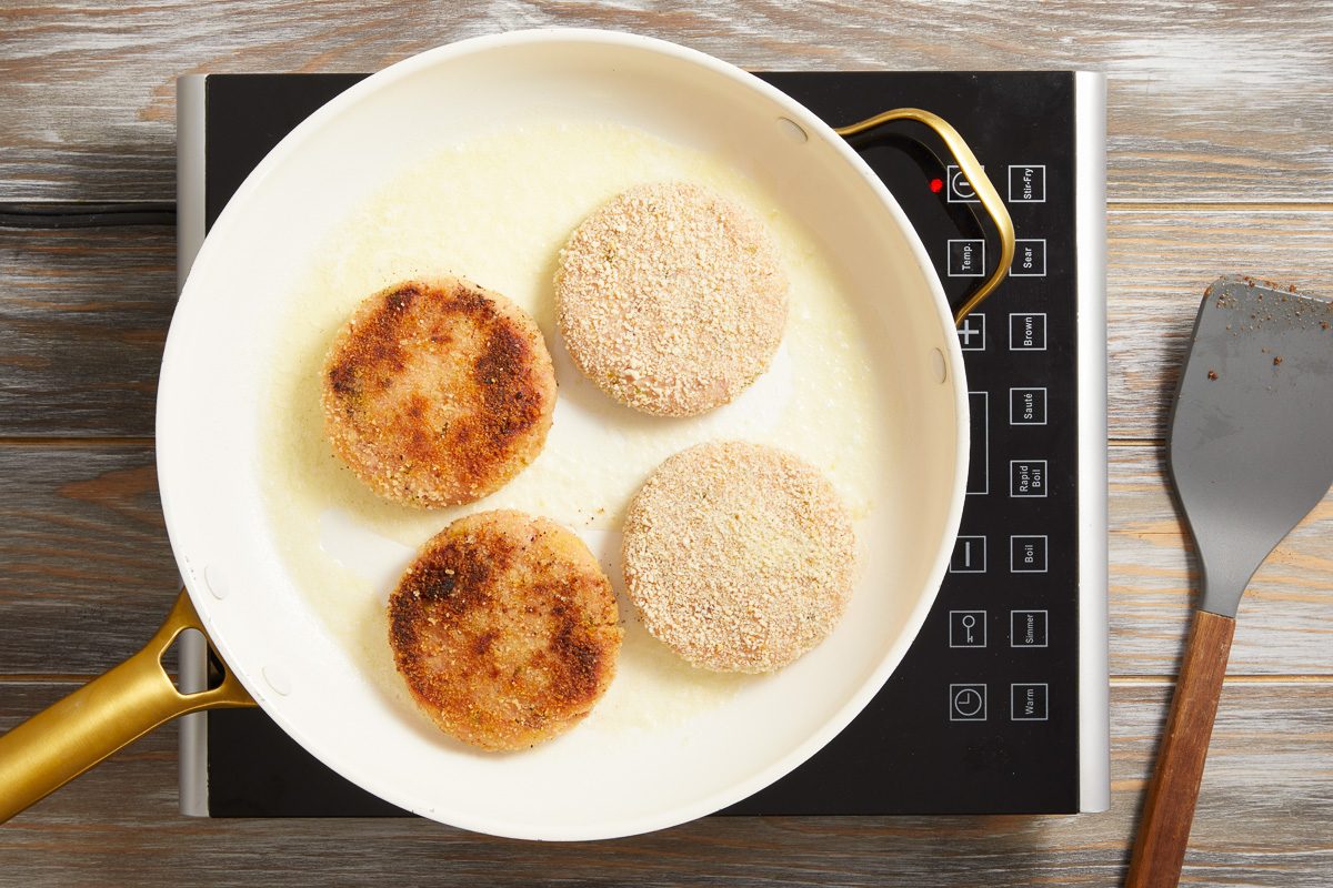 patties being cooked in a skillet