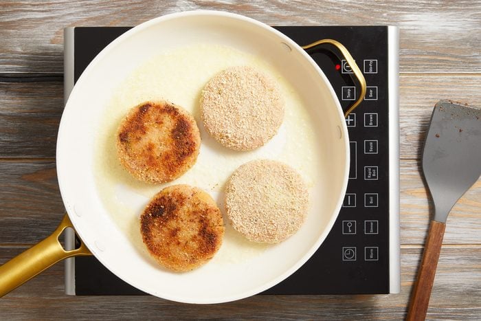 patties being cooked in a skillet