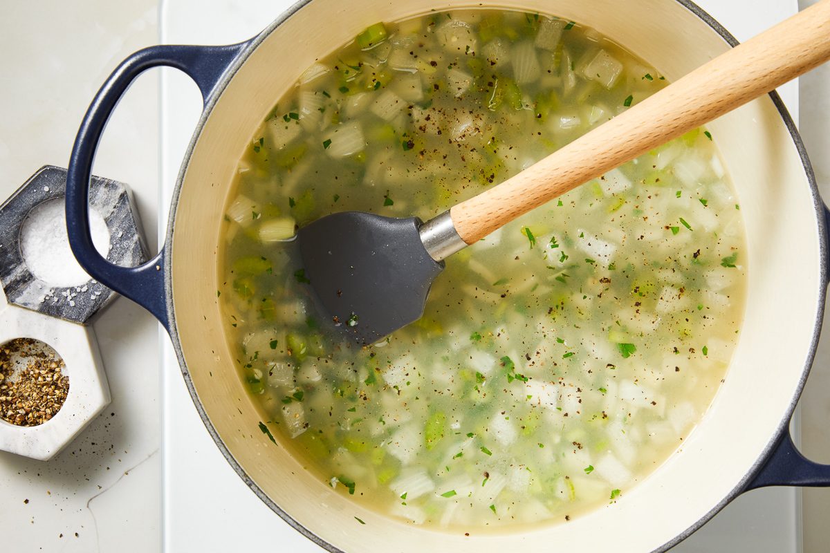 onions, celery, water, wine/broth, clam juice, parsley, garlic, salt and pepper combined in a stockpot