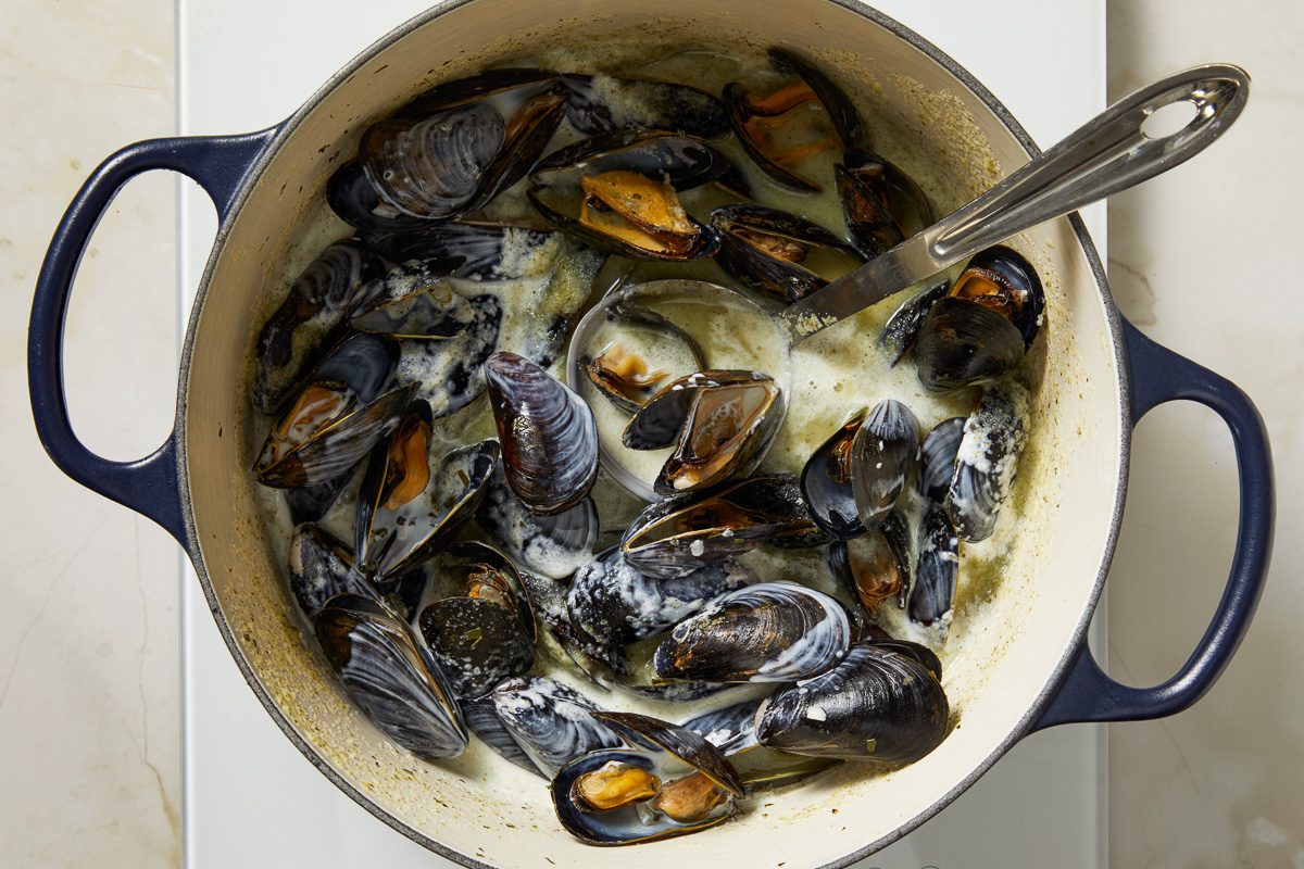mussels and cream added to liquid mixture