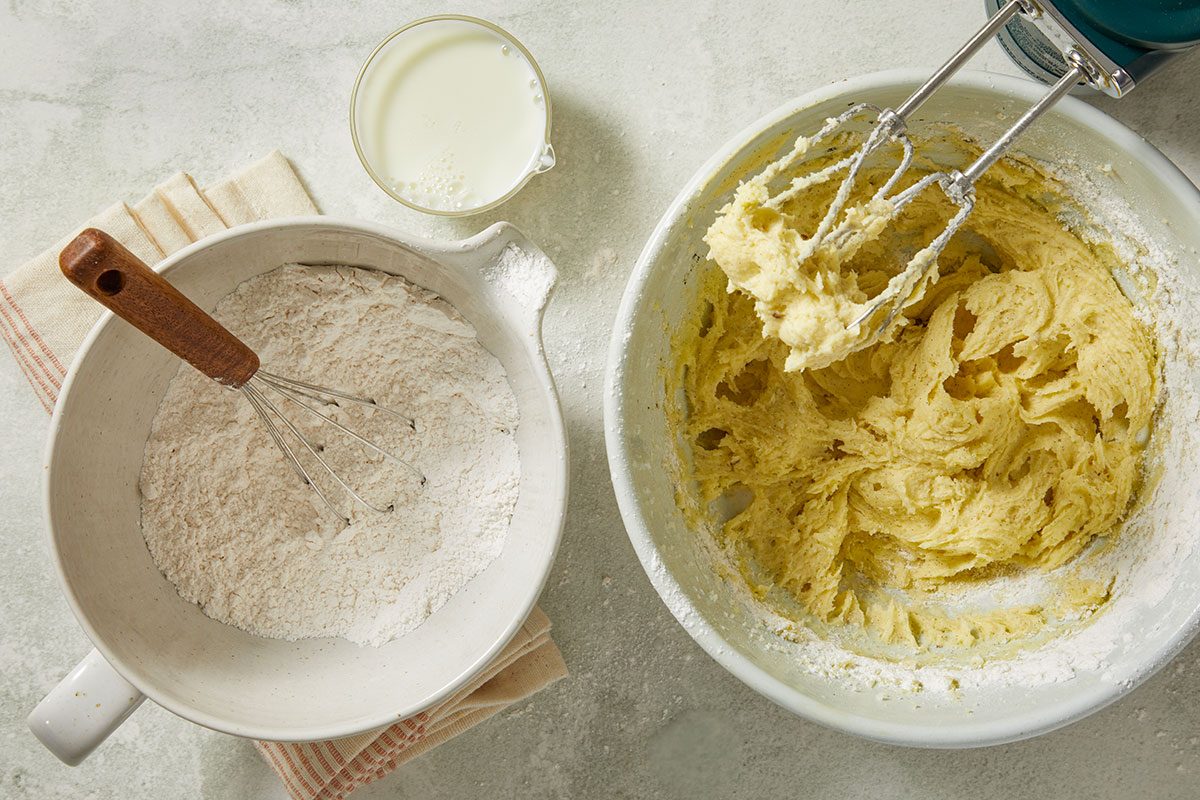 Overhead view of cake flour, baking powder and salt whisked together before being added to the batter. The dry ingredients ensure light, tender cupcakes.