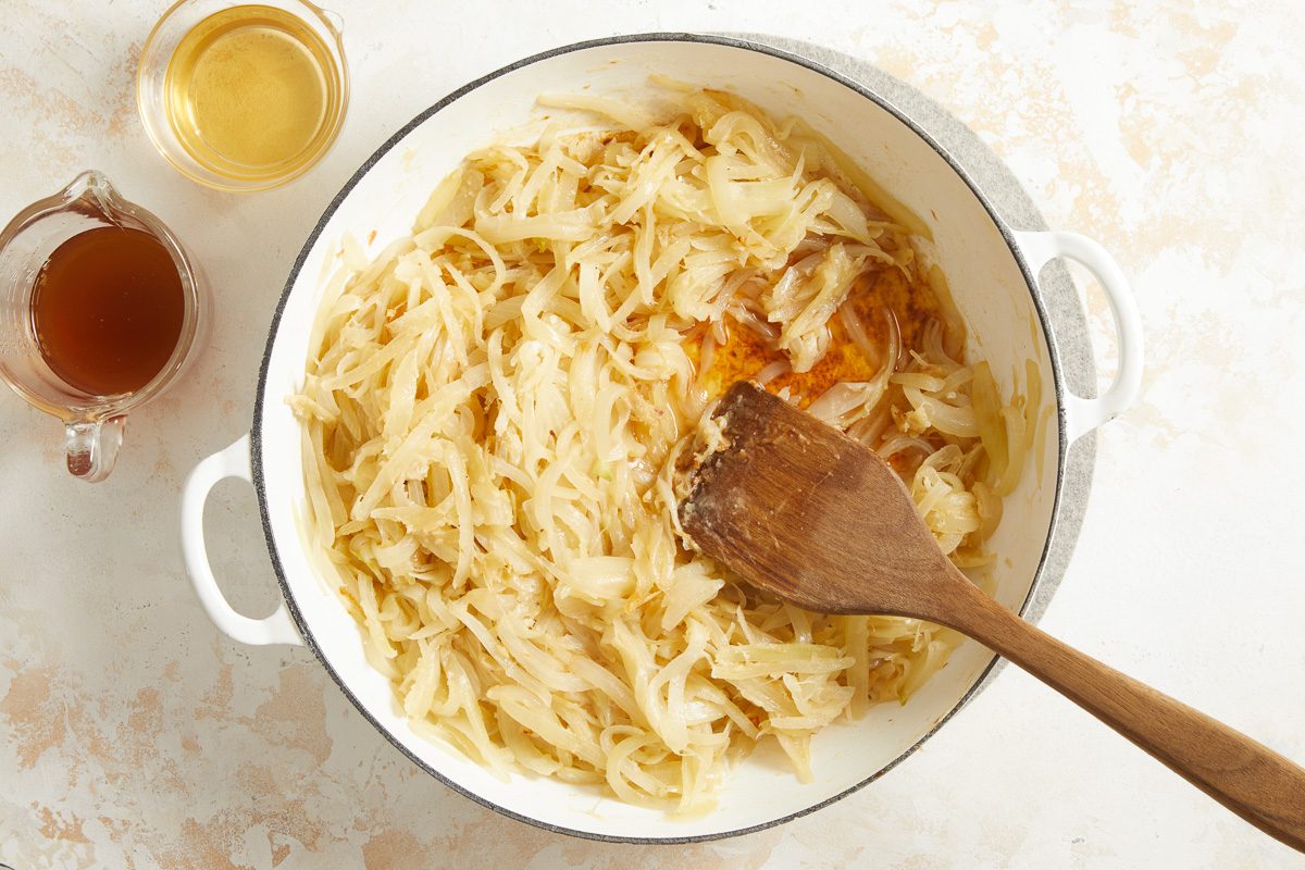 adding broth and sherry to onions