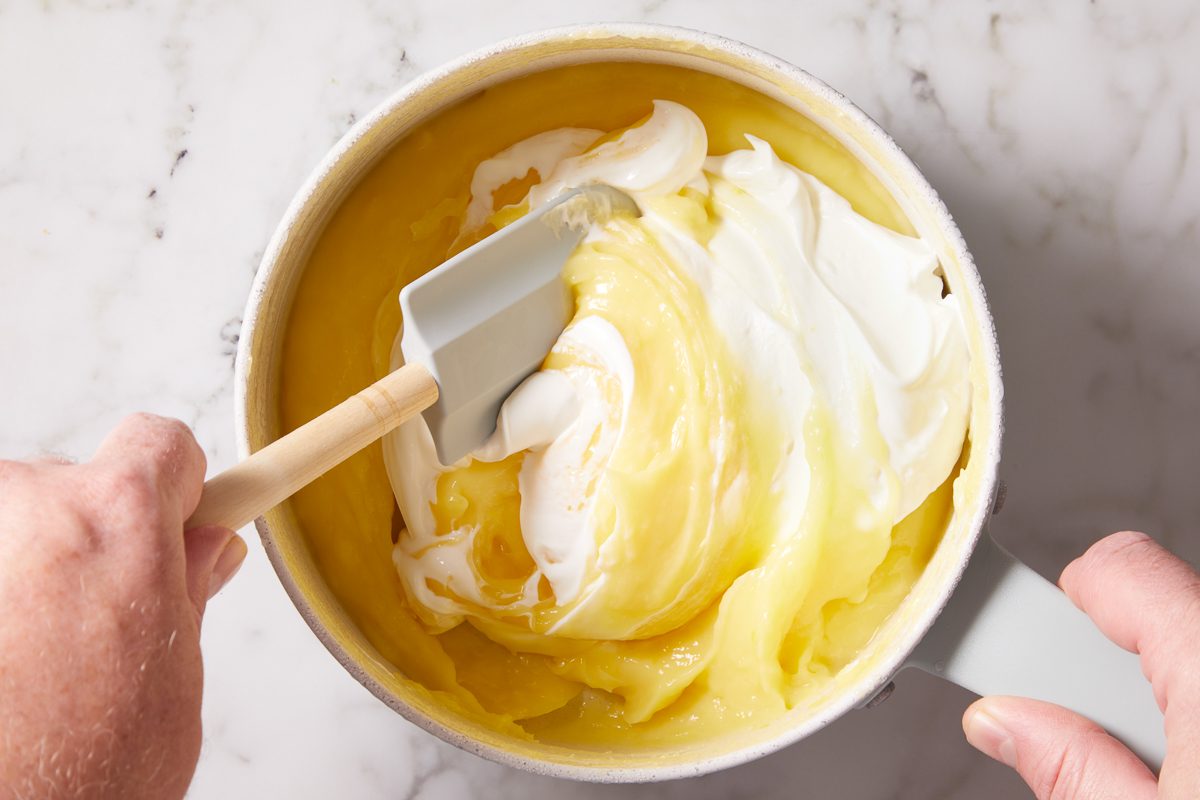 sour cream being mixed in with pie filling
