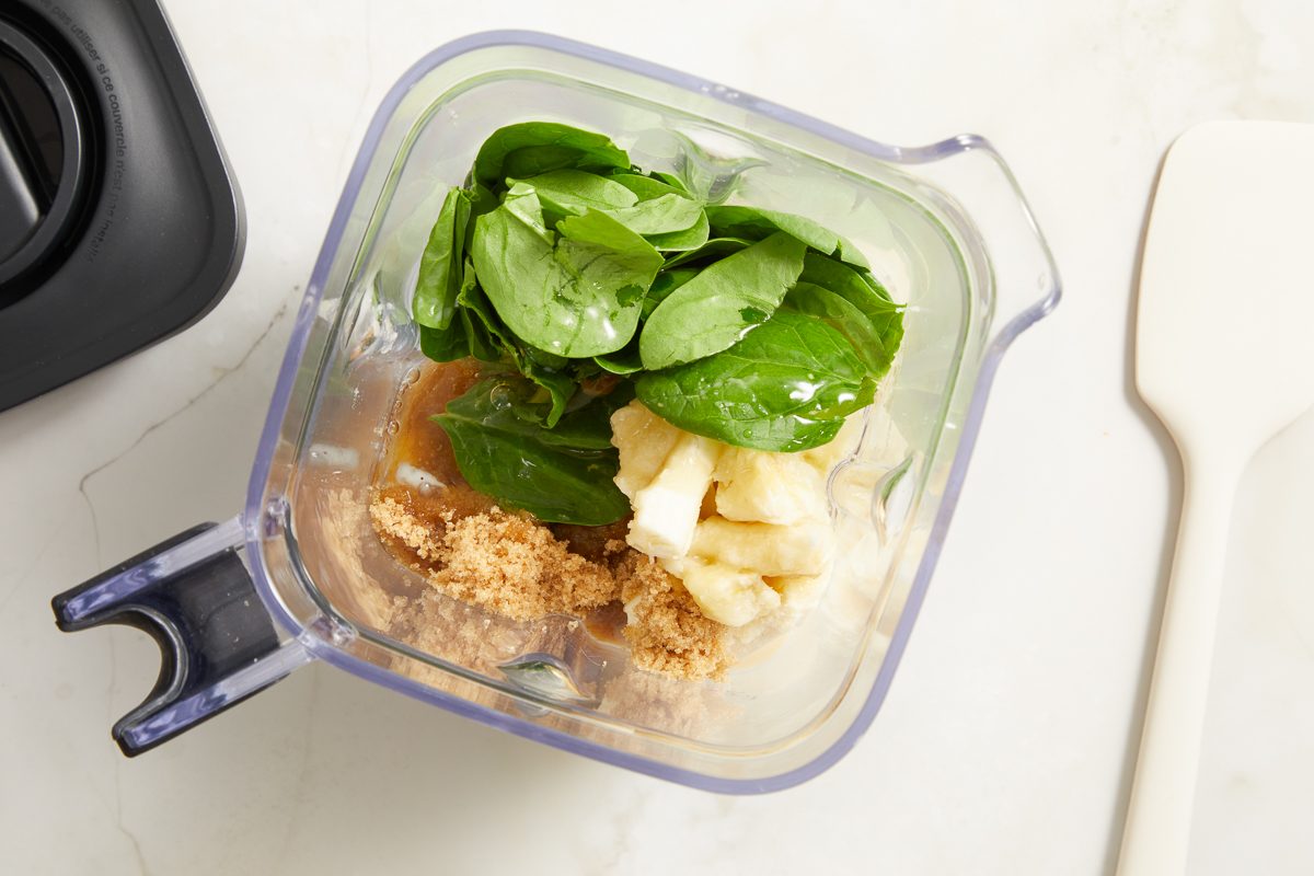 egg whites, spinach, mashed bananas, brown sugar, milk and oil in a blender