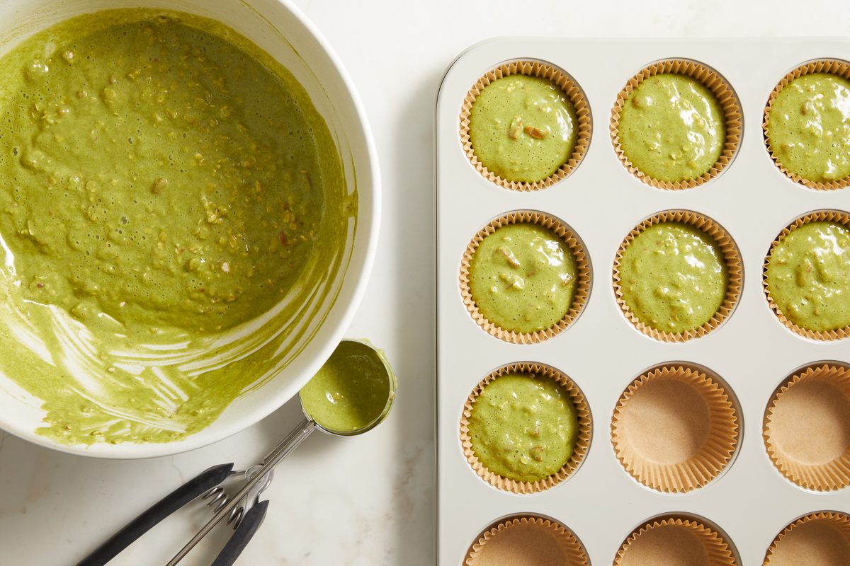 muffin cups lined with paper filled with batter