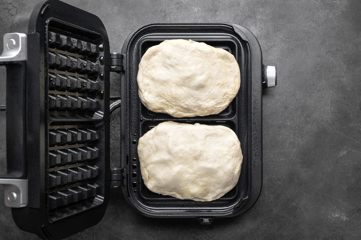 biscuits placed in waffle maker for baking