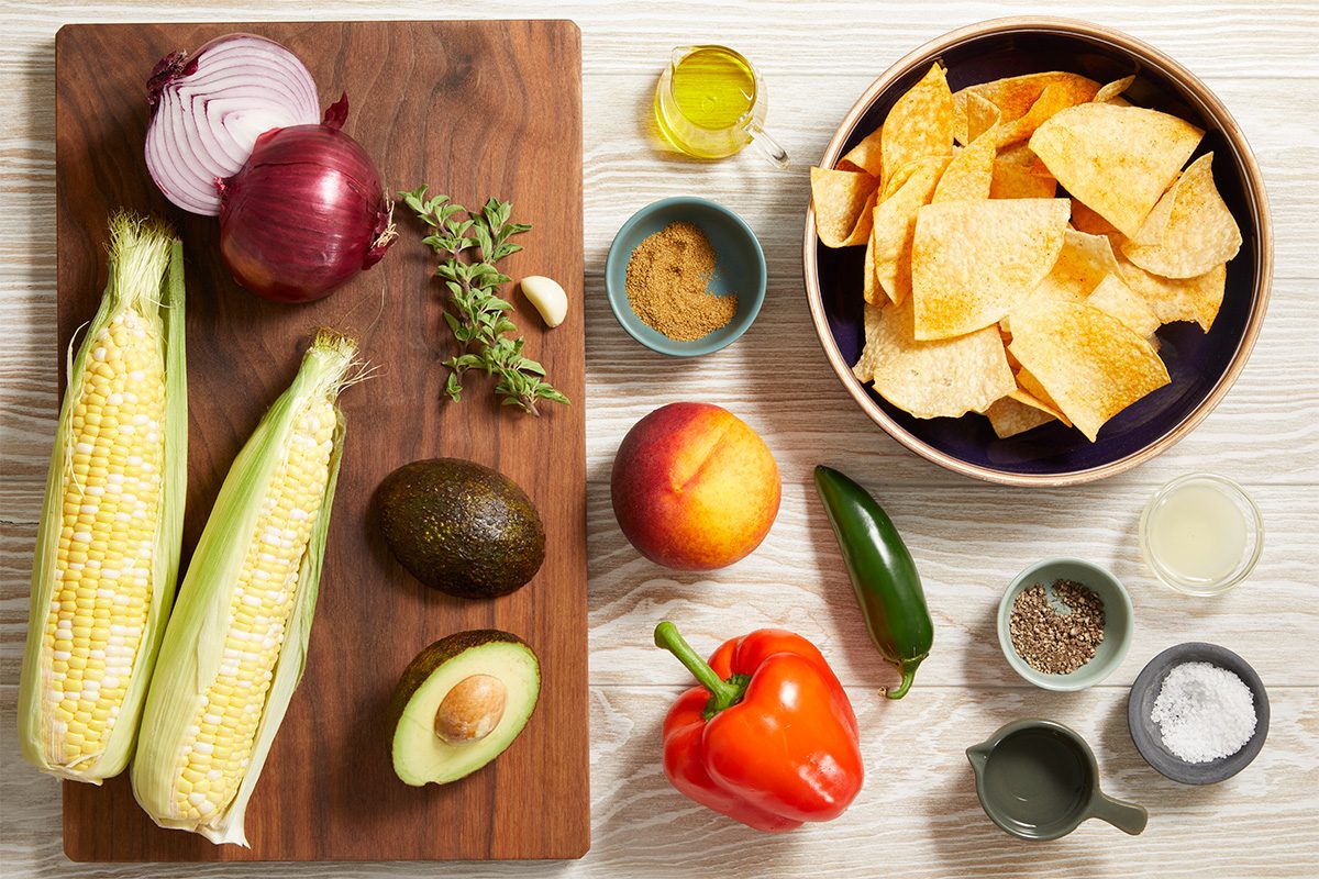 Overhead shot of ingredients for Fresh Corn & Avocado Dip
