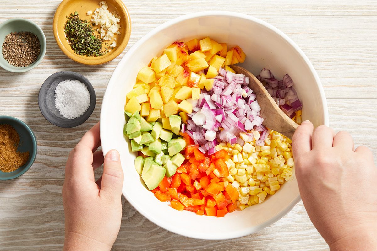 Combine first chopped ingredients in a large bowl