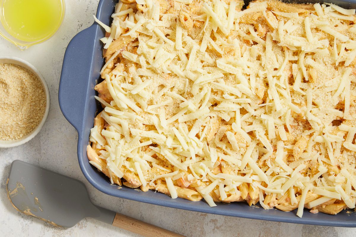 Pasta sprinkled with cheese and bread crumbs, then drizzled with butter