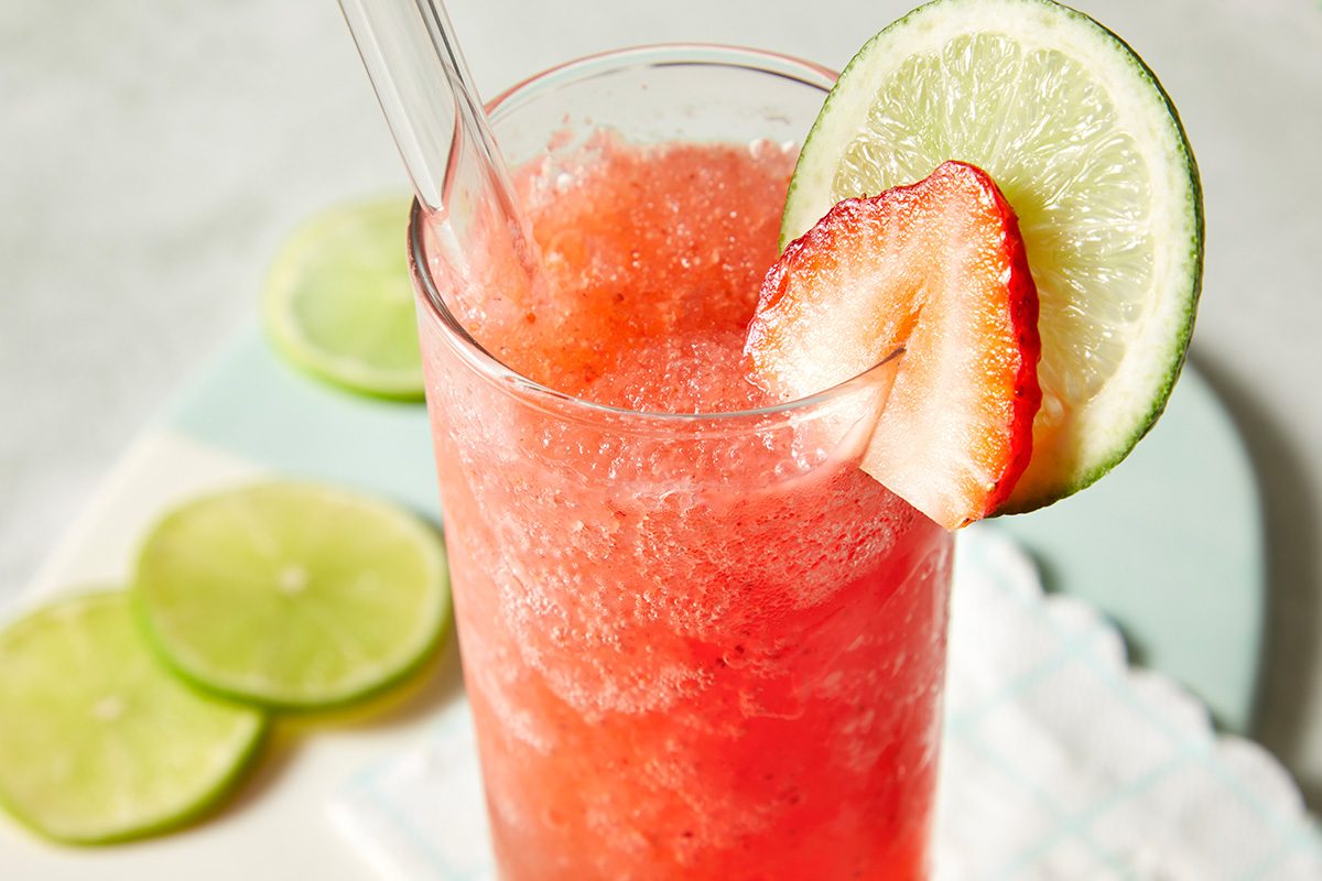 Close-up of a frozen strawberry daiquiri in a tall glass