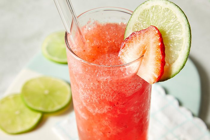 Close-up of a frozen strawberry daiquiri in a tall glass
