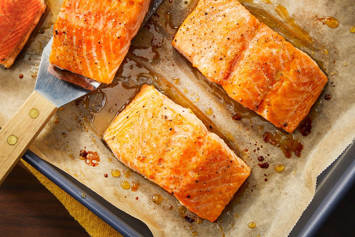 Overhead horizontal image of baked salmon fillets with caramelized hot honey glaze