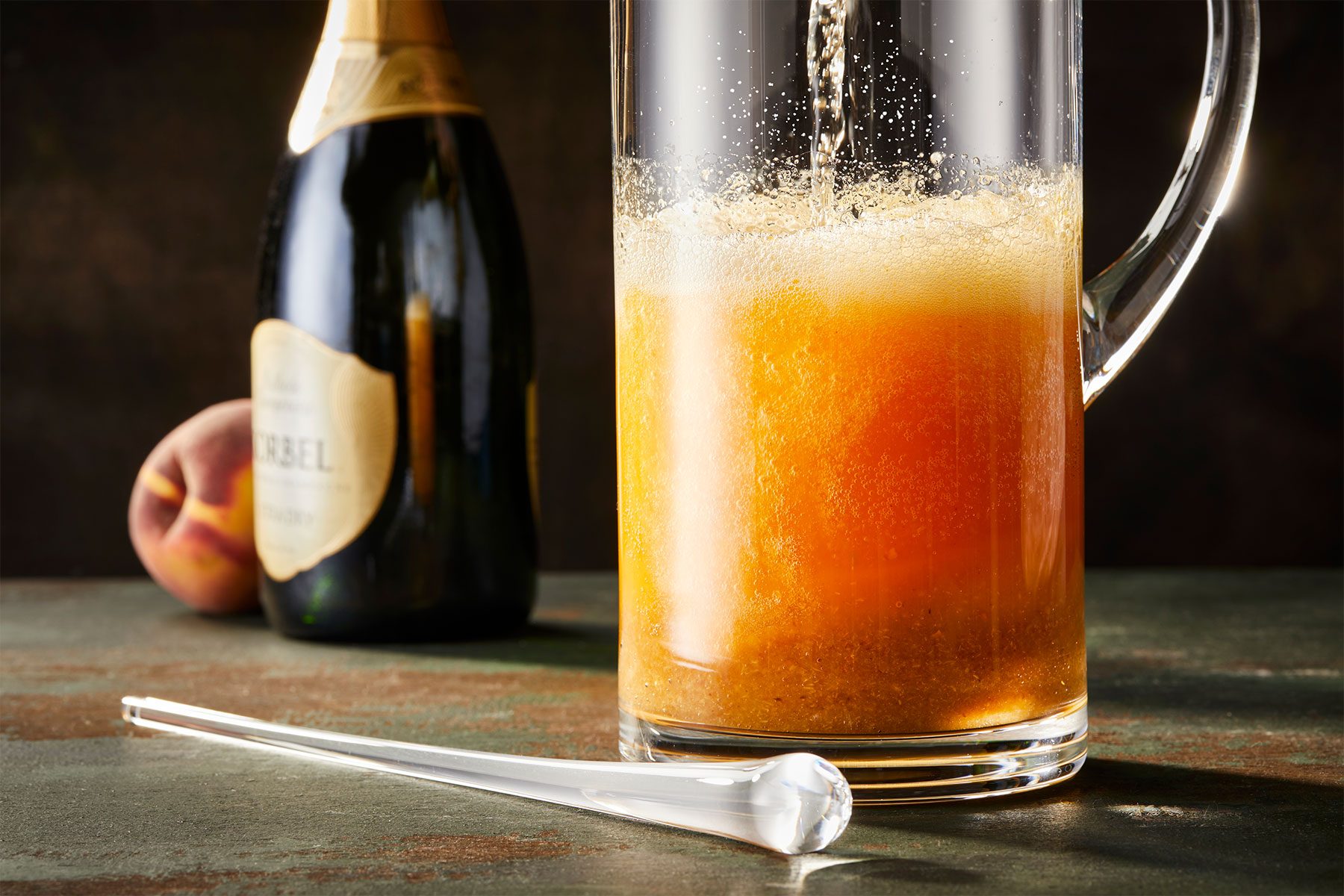 Peach puree ina pitcher on a table