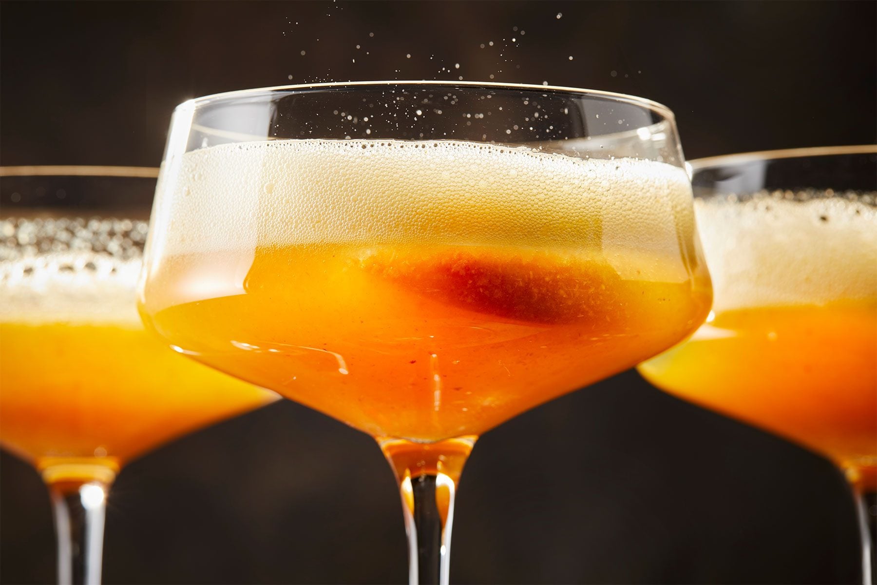 Tree glasses of Hot Honey Peach Bellini 