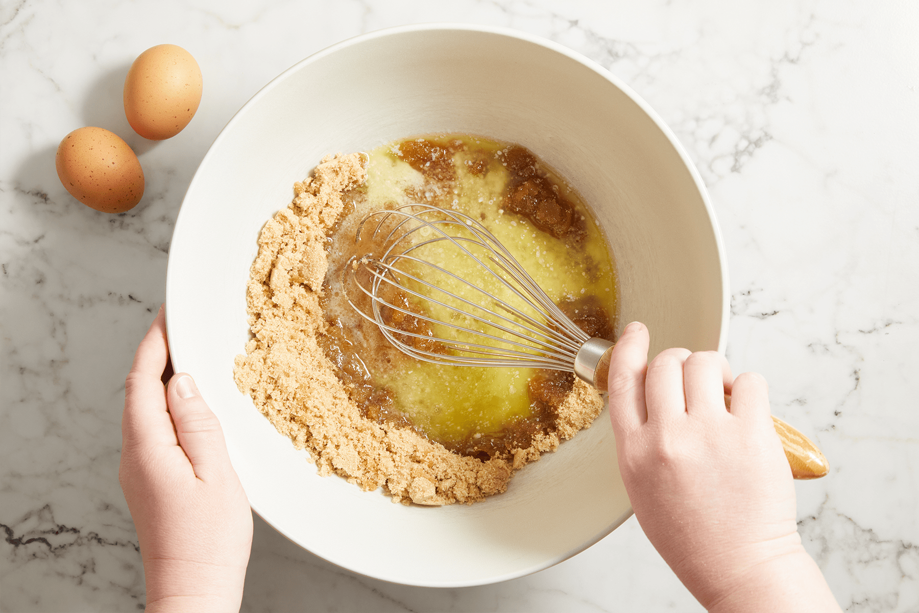 mixing egg brown sugar butter in a bowl 