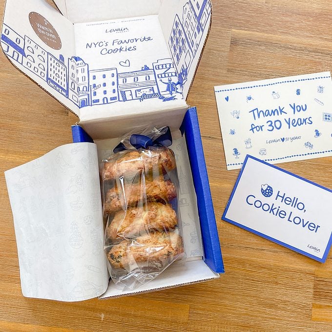 Levain Carrot Cake Cookies in box next to cards