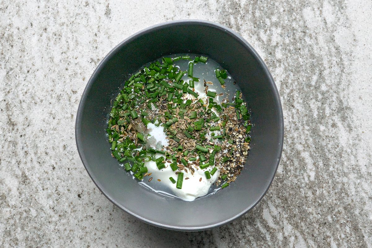 sour cream, vinegar, chives, dill seed, pepper and sugar in a small bowl