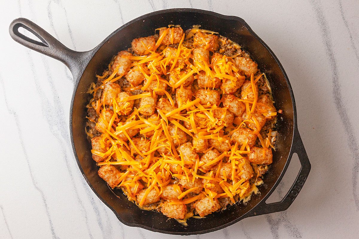 The casserole is baked until the tater tots are golden and crispy and the cheese is melted.