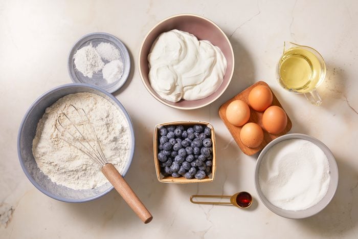 Eggs, sugar, canola oil, flour, leavening agents, sour cream and blueberries