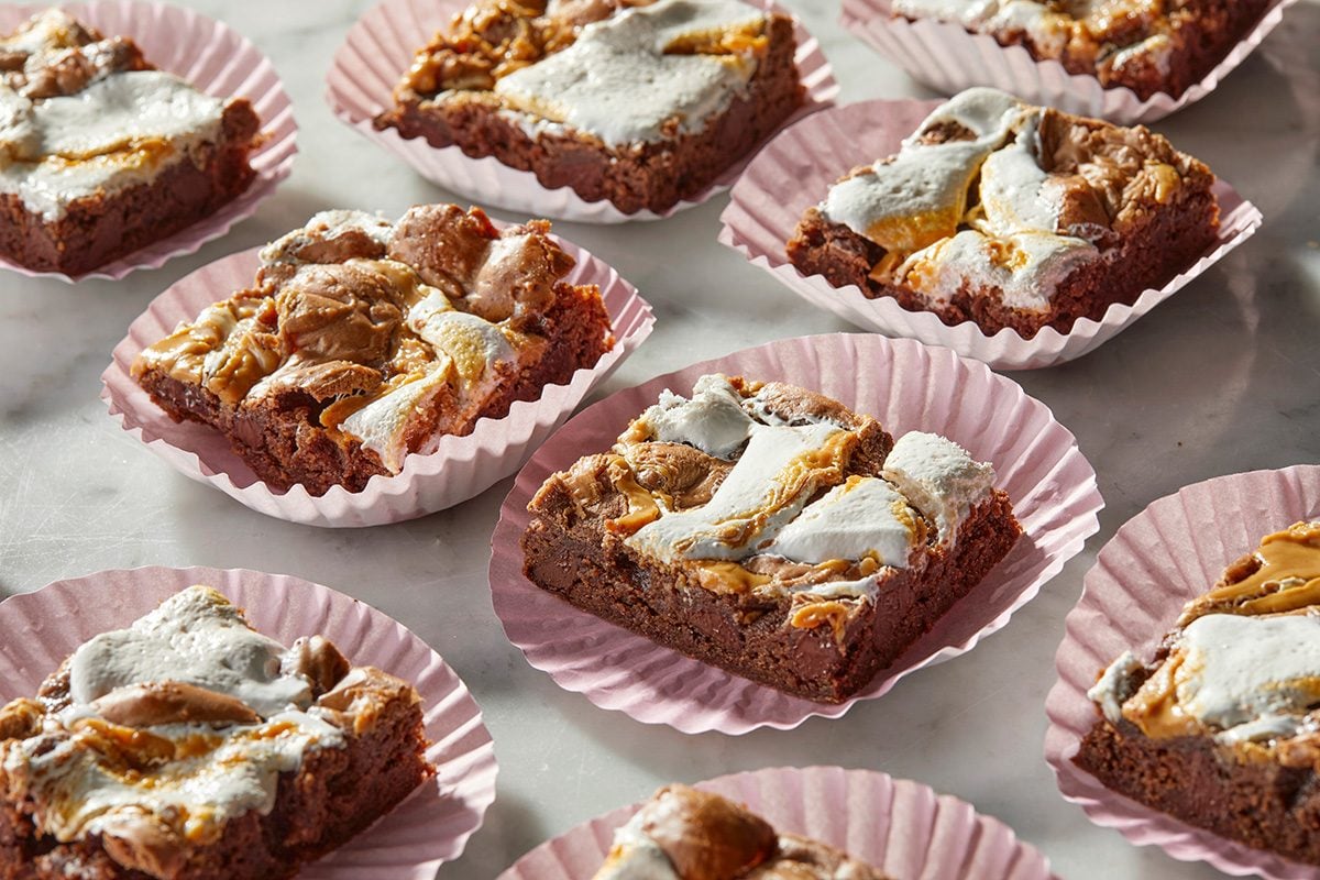 chocolate brownies topped with toasted marshmallows and caramel