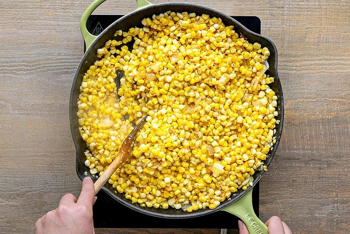 corn, salt and pepper added to skillet with onions and butter