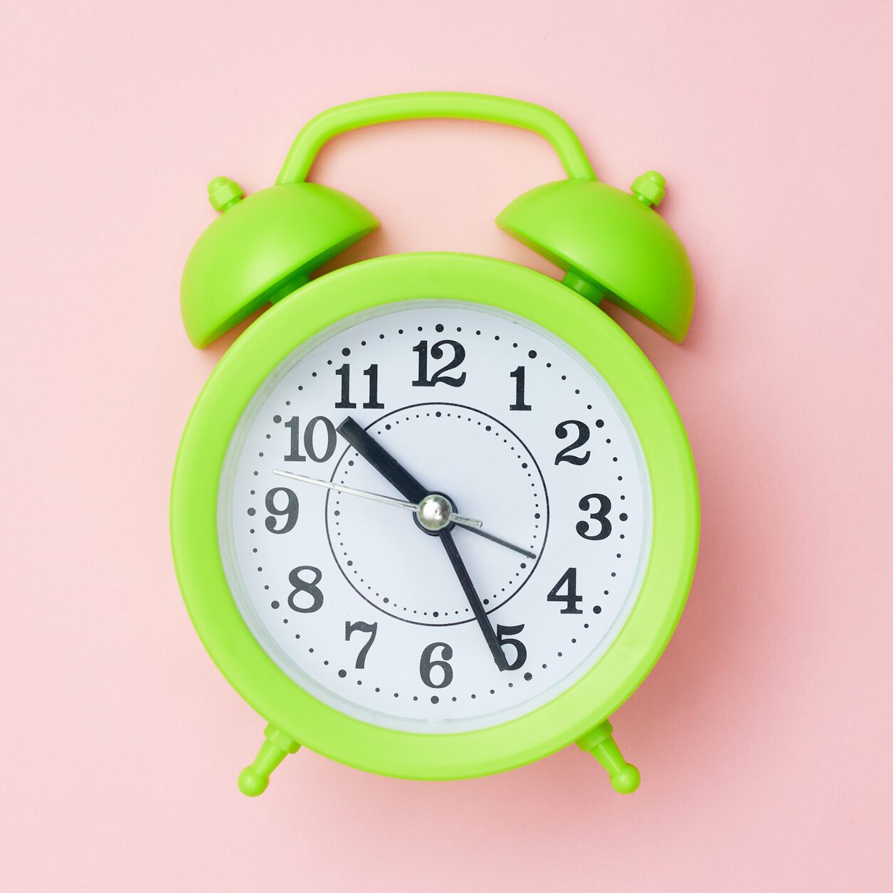 minimalism green Alarm clock on a pink background