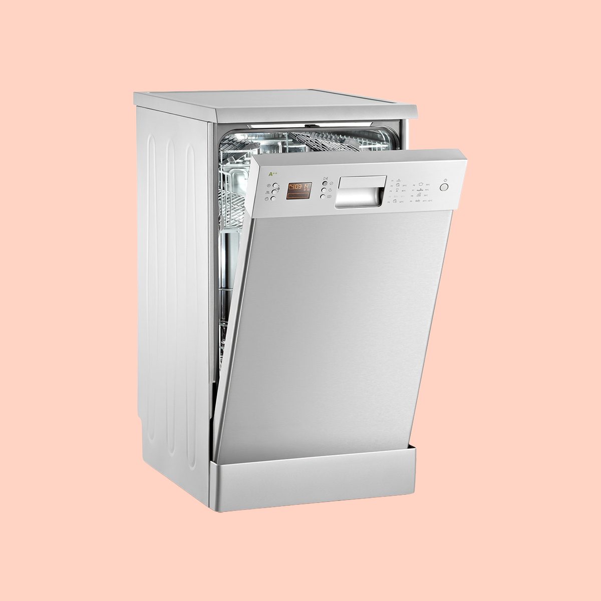 A silver dishwasher with its door partially open, revealing the interior racks, set against a plain light peach background.
