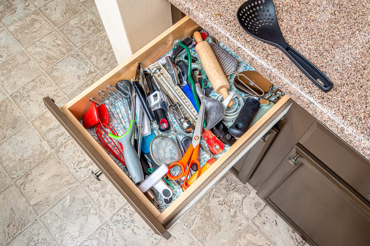 top view of cluttered kitchen drawer