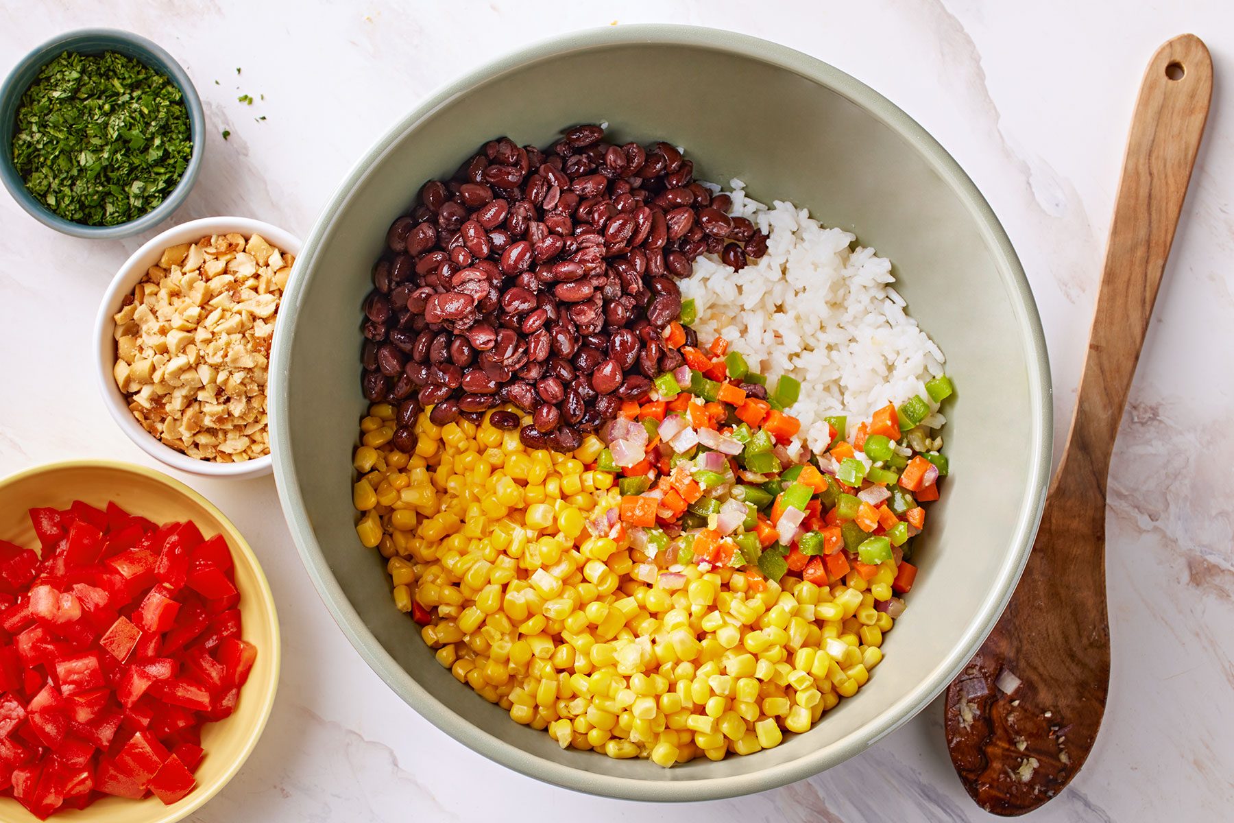cooked vegetables to the rice. Stir in the corn, beans, tomatoes, peanuts and cilantro.