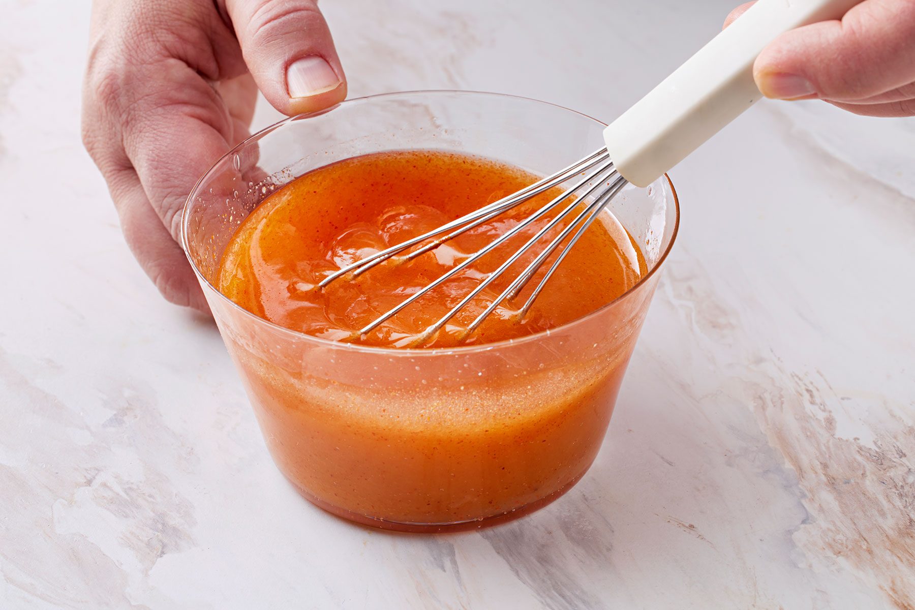 In a small bowl, whisk together the olive oil, lemon juice, cayenne and cumin