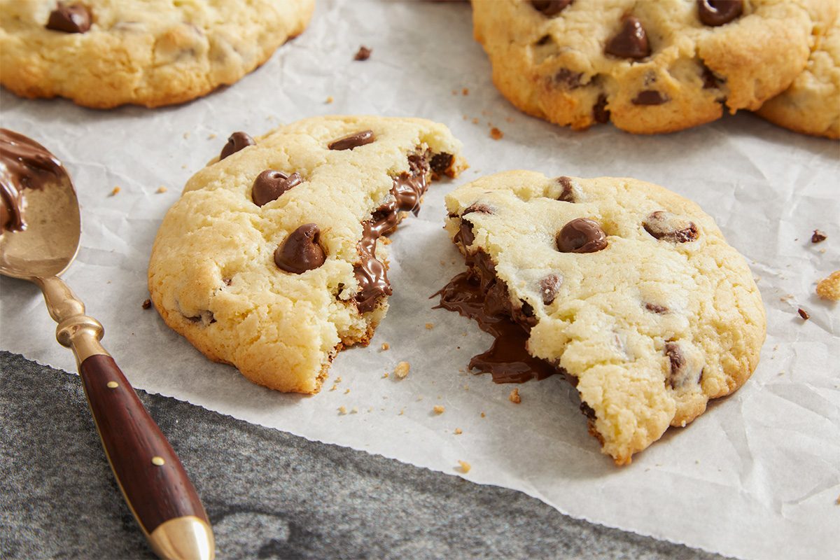 broken cookie revealing melted Nutella center.