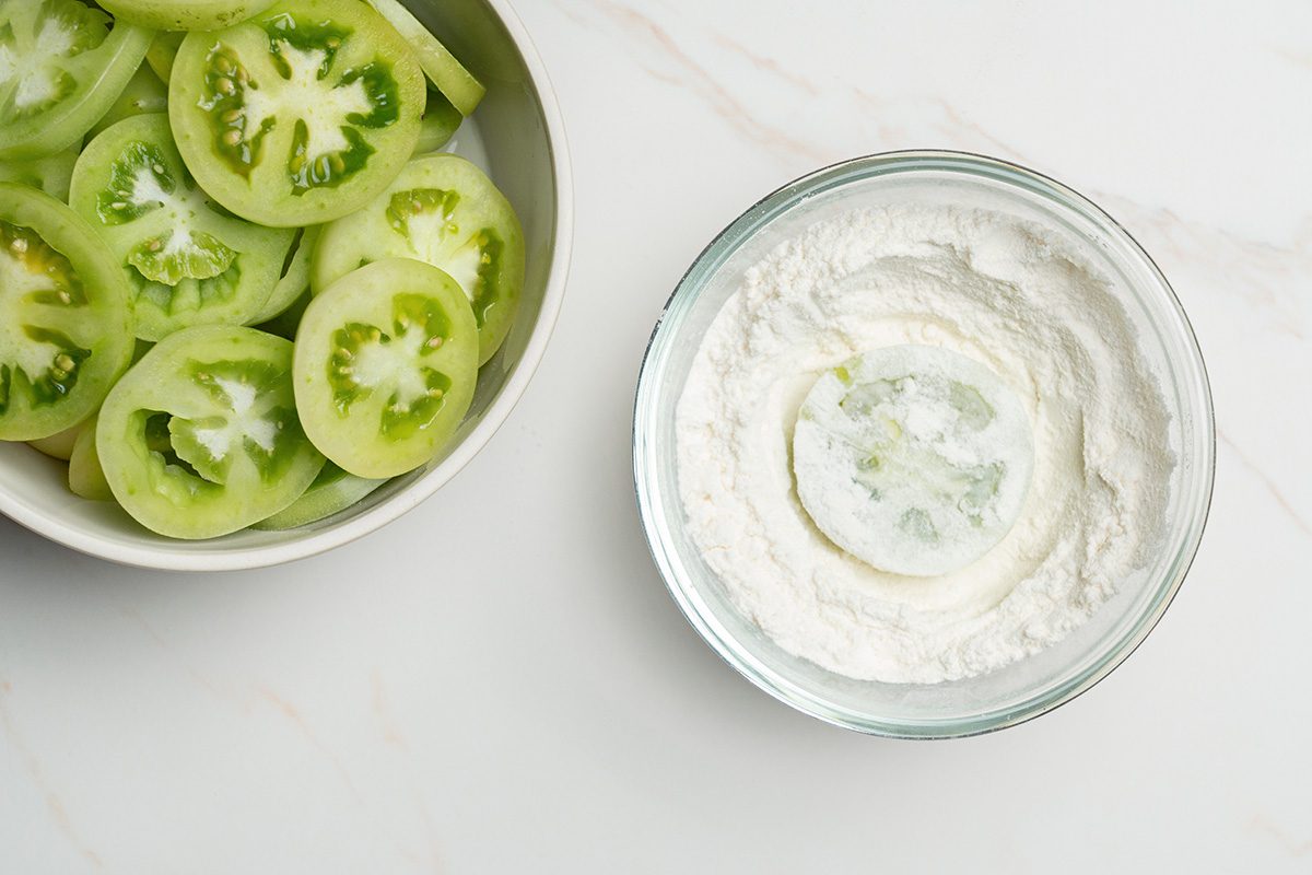 Overhead shot of dip tomatoes in flour