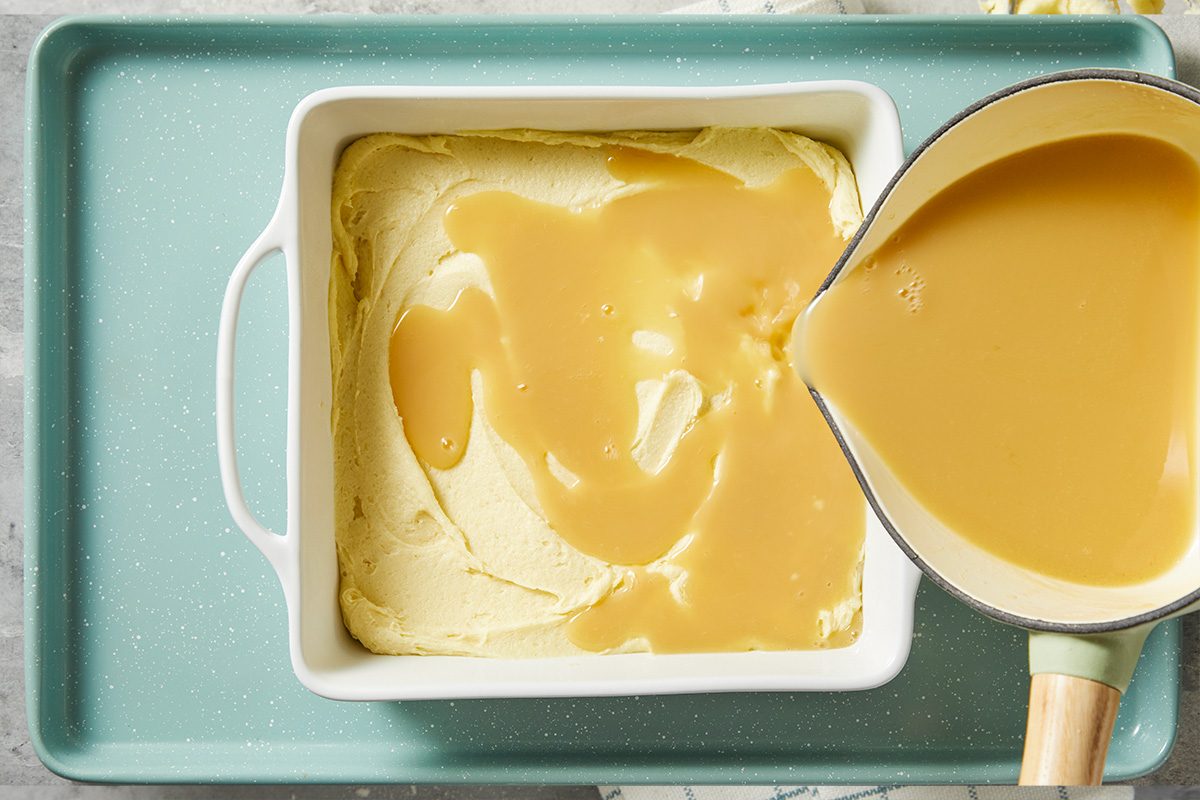 A horizontal overhead image shows maple cream sauce being poured over batter in a baking dish.
