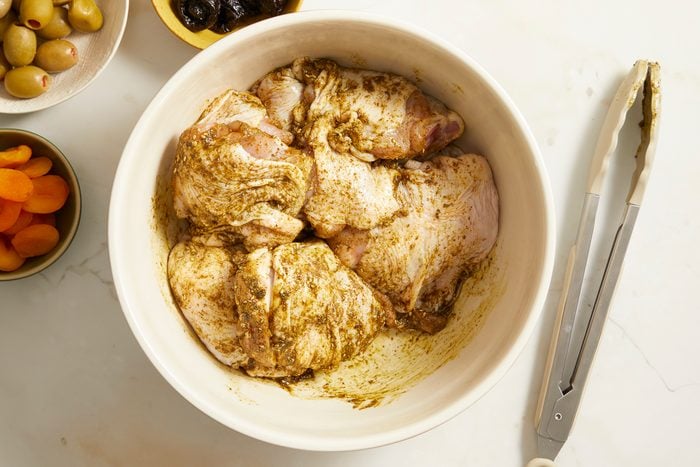 chicken seasoned with za’atar seasoning, dried oregano, salt, ground cumin, ground turmeric and olive oil