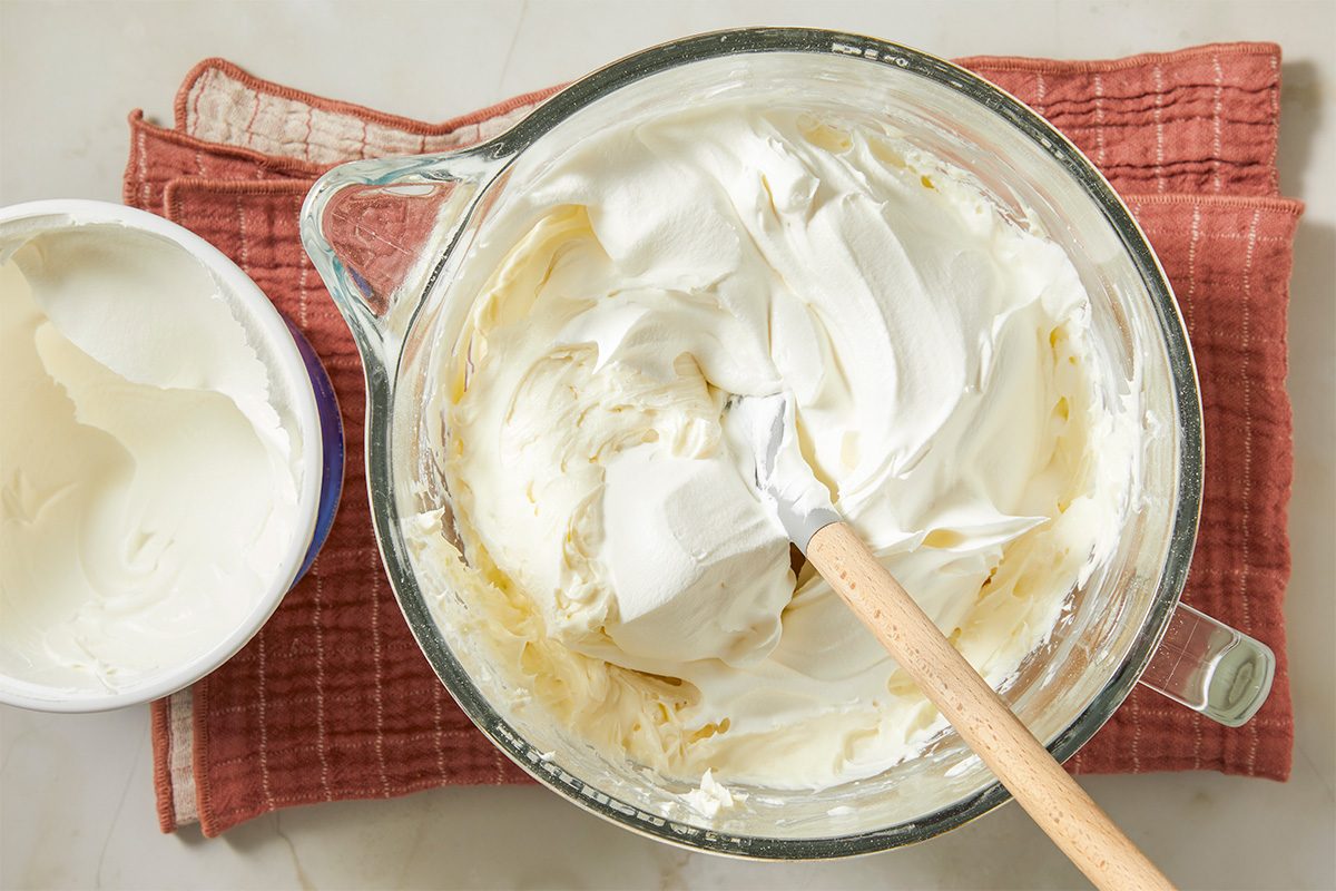 Cream cheese, confectioners’ sugar, vanilla, and whipped topping are blended until smooth and fluffy.