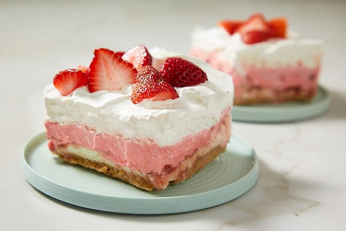 The finished dessert is cut into squares and partially served from the baking dish.