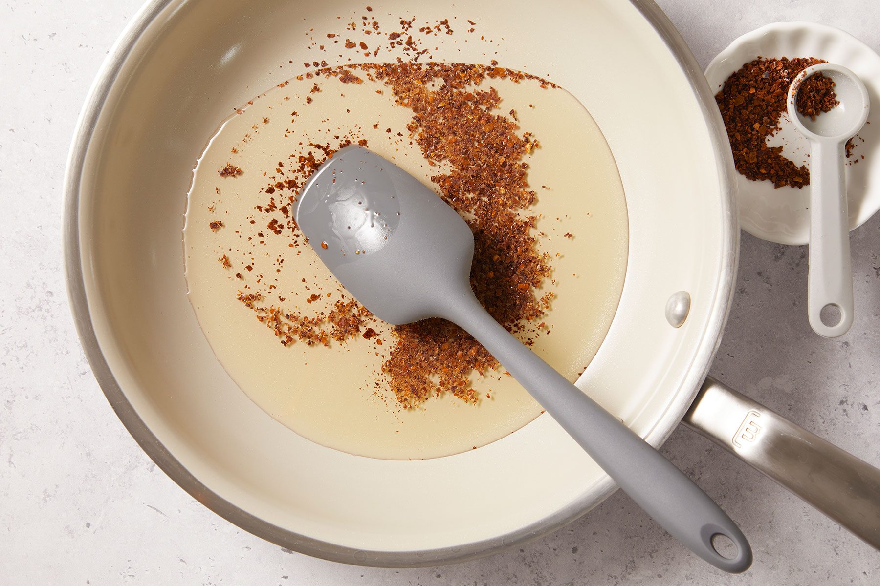 cooking Aleppo pepper or red pepper flakes in oil
