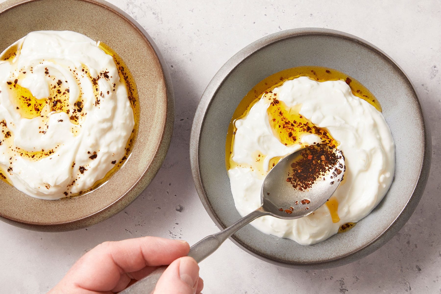 drizzle garlic oil over yogurt