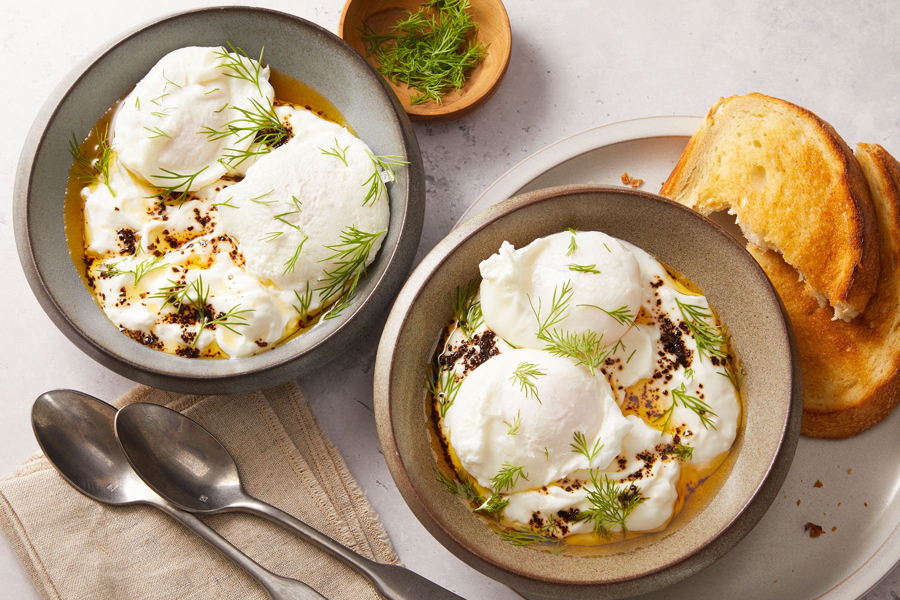Turkish Eggs Cilbir served with toast