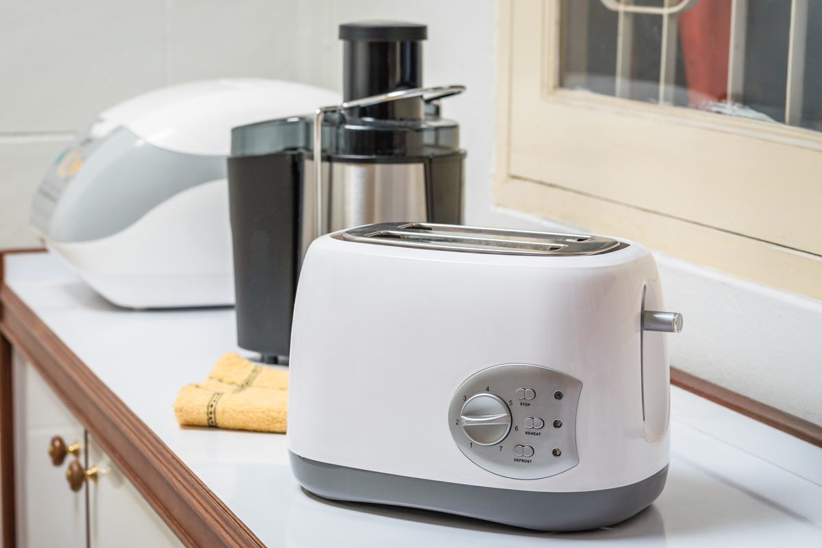 Electric appliances in a kitchen, toaster, juice extractor and rice cooker