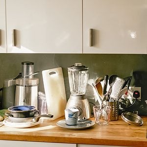 Cluttered worktop in kitchen